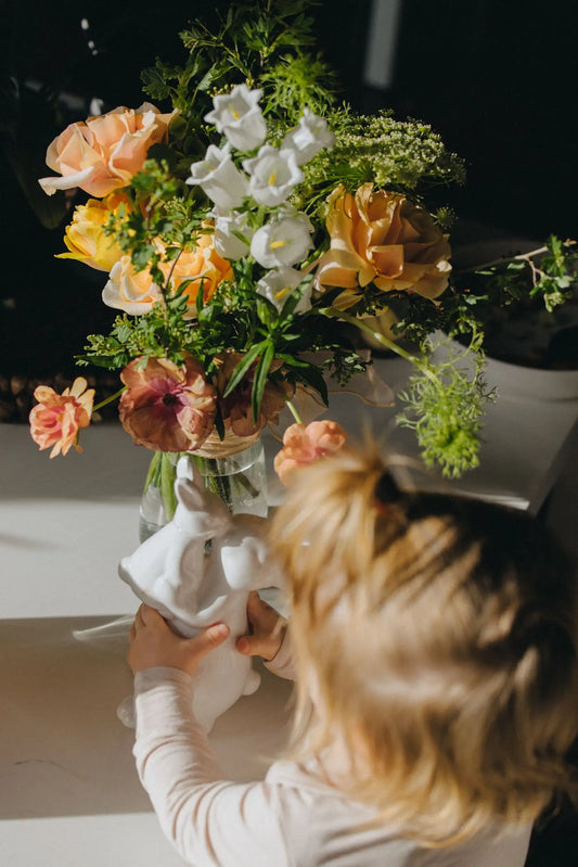 Personalized small flower bouquet being arranged in vase hand-crafted by Kvetka Flower Portland Oregon