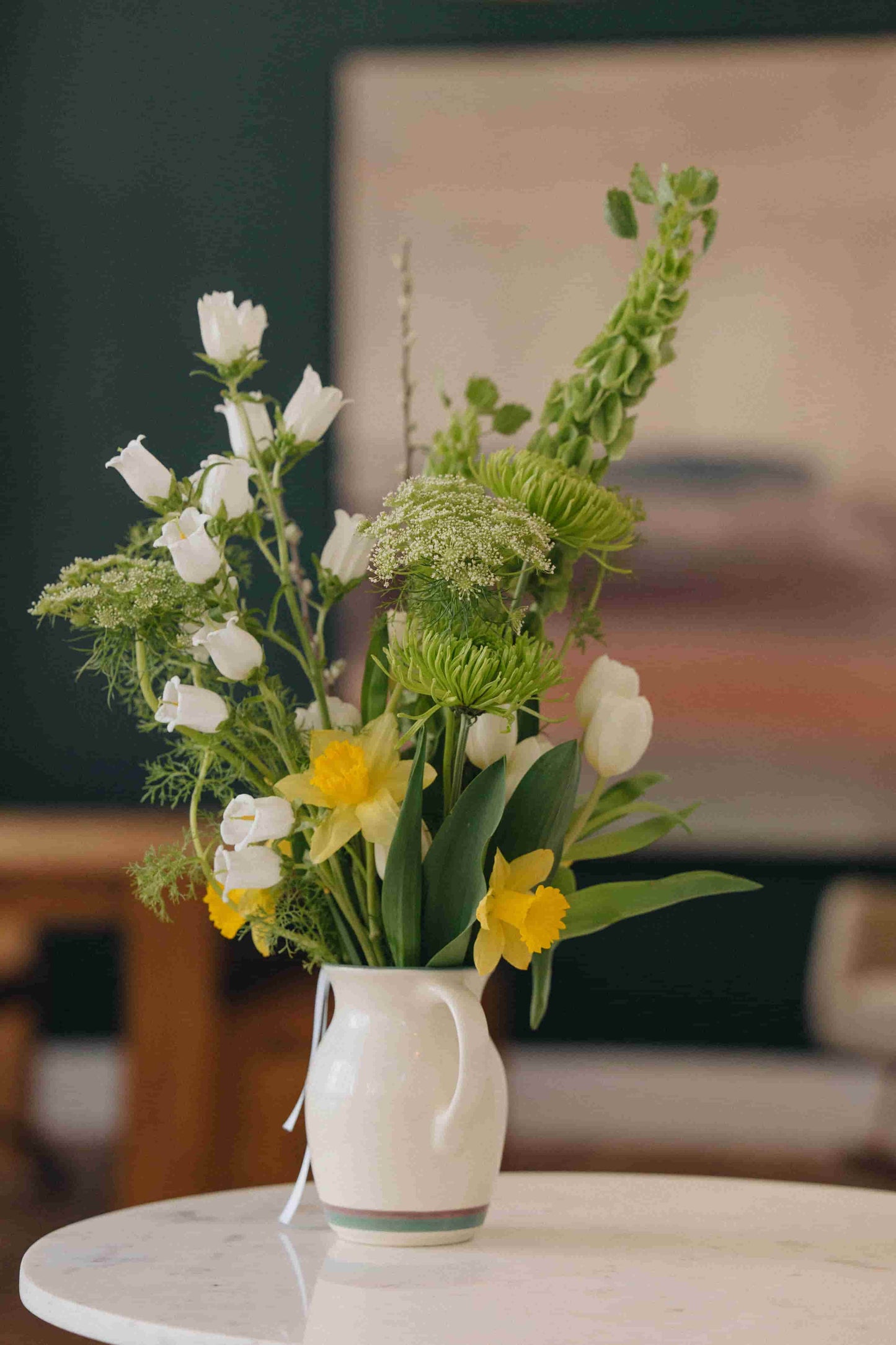 Deluxe flower subscription bouquet with daffodils, tulips, and Queen Anne's lace in a ceramic pitcher – Kvetka Flower Portland OR