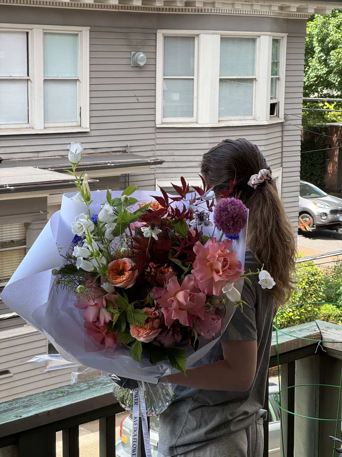 Extra large fresh seasonal bouquet with pink garden roses, burgundy Japanese maple and white campanula wrapped in white paper, by Portland florist Kvetka Flower