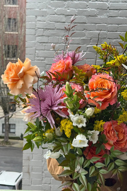 Detail of large seasonal bouquet orange roses lavender mums lush greenery Portland Kvetka Flower