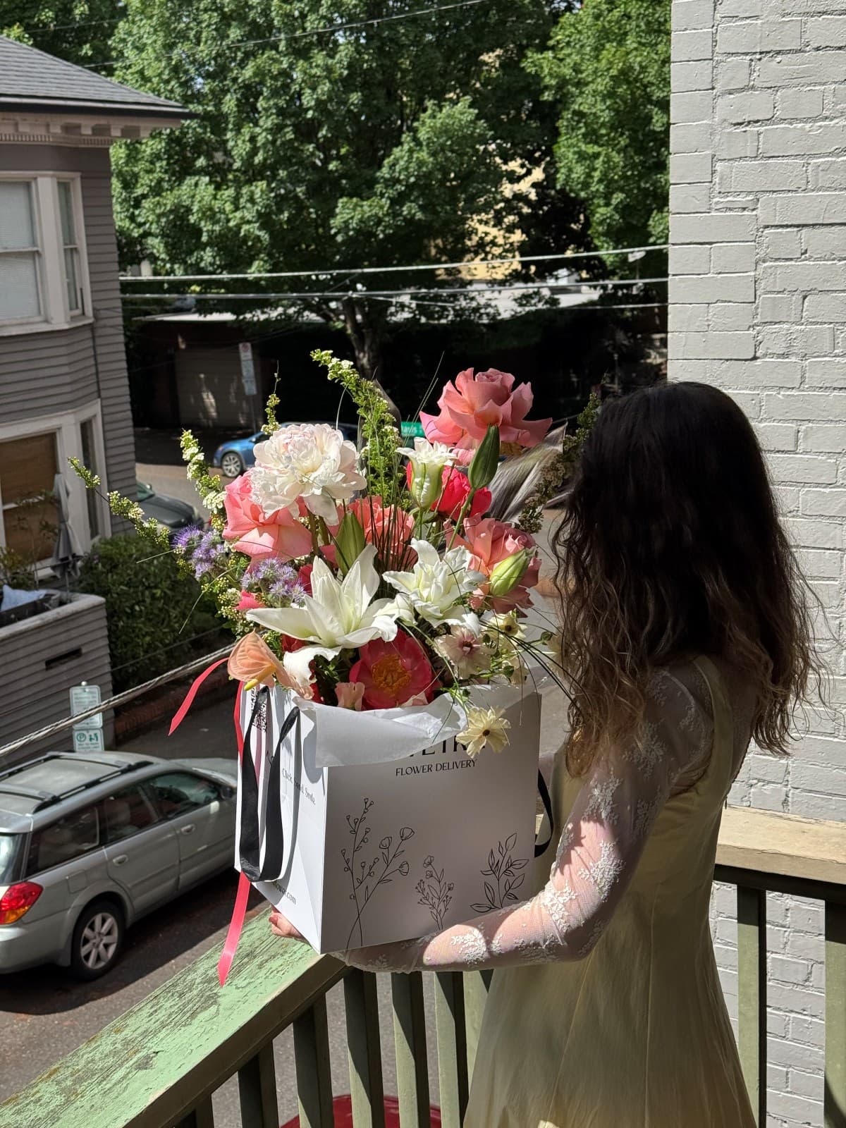 Fresh seasonal summer bouquet with peonies, pink roses, white lilies, ranunculus, anthurium, and thistle in a Kvetka Flower gift box, Portland
