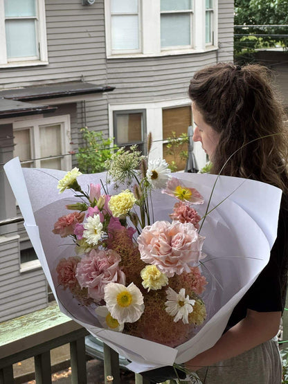 Medium fresh seasonal bouquet with blush garden roses, icelandic poppies, carnations and cosmos wrapped in white paper, by Kvetka Flower Portland