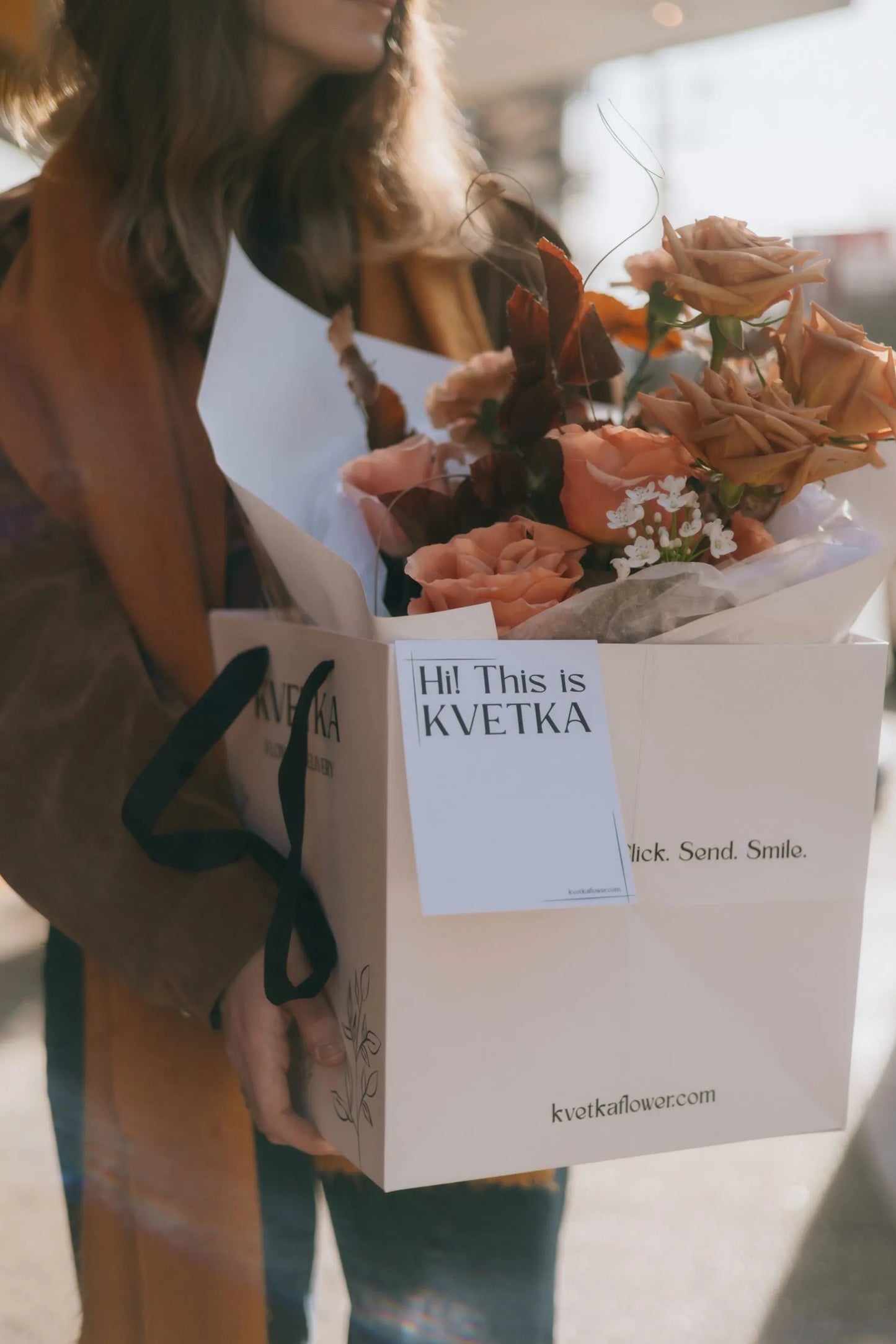 Close-up of premium beige roses bouquet with orchids in Kvetka gift bag