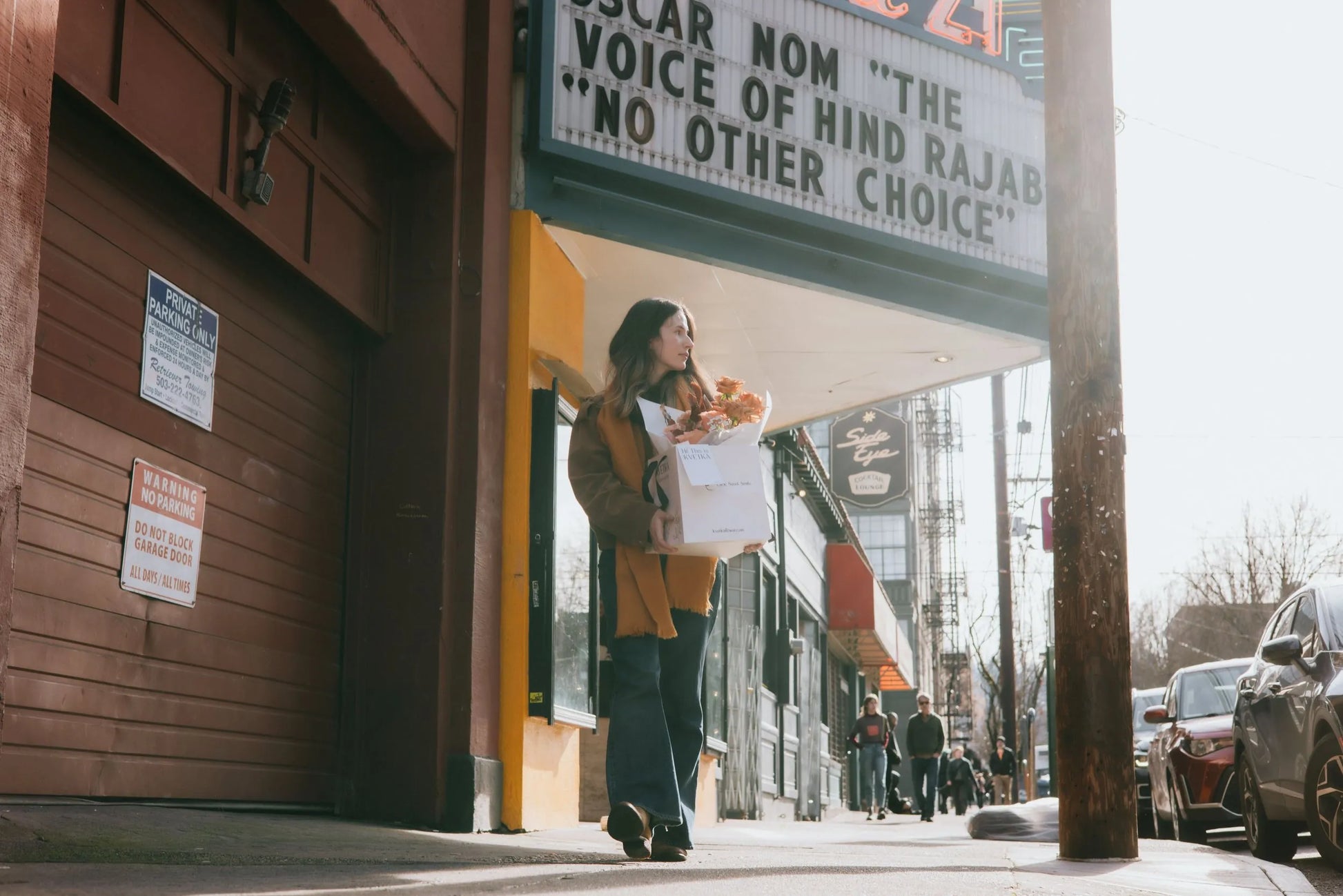 Premium beige roses bouquet held by woman in downtown Portland