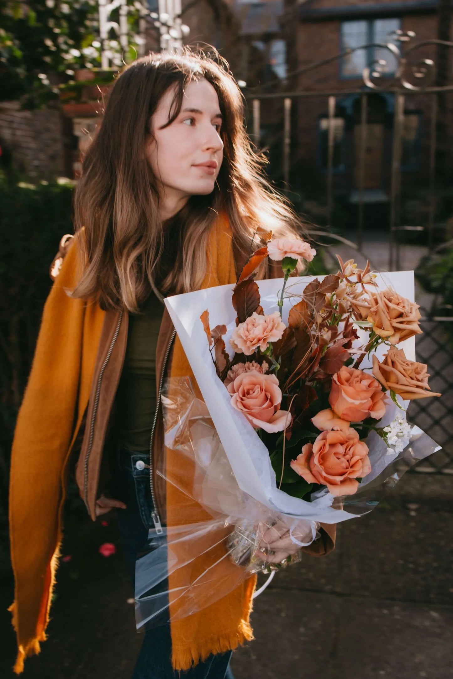 Premium beige roses bouquet with autumn accents in golden hour