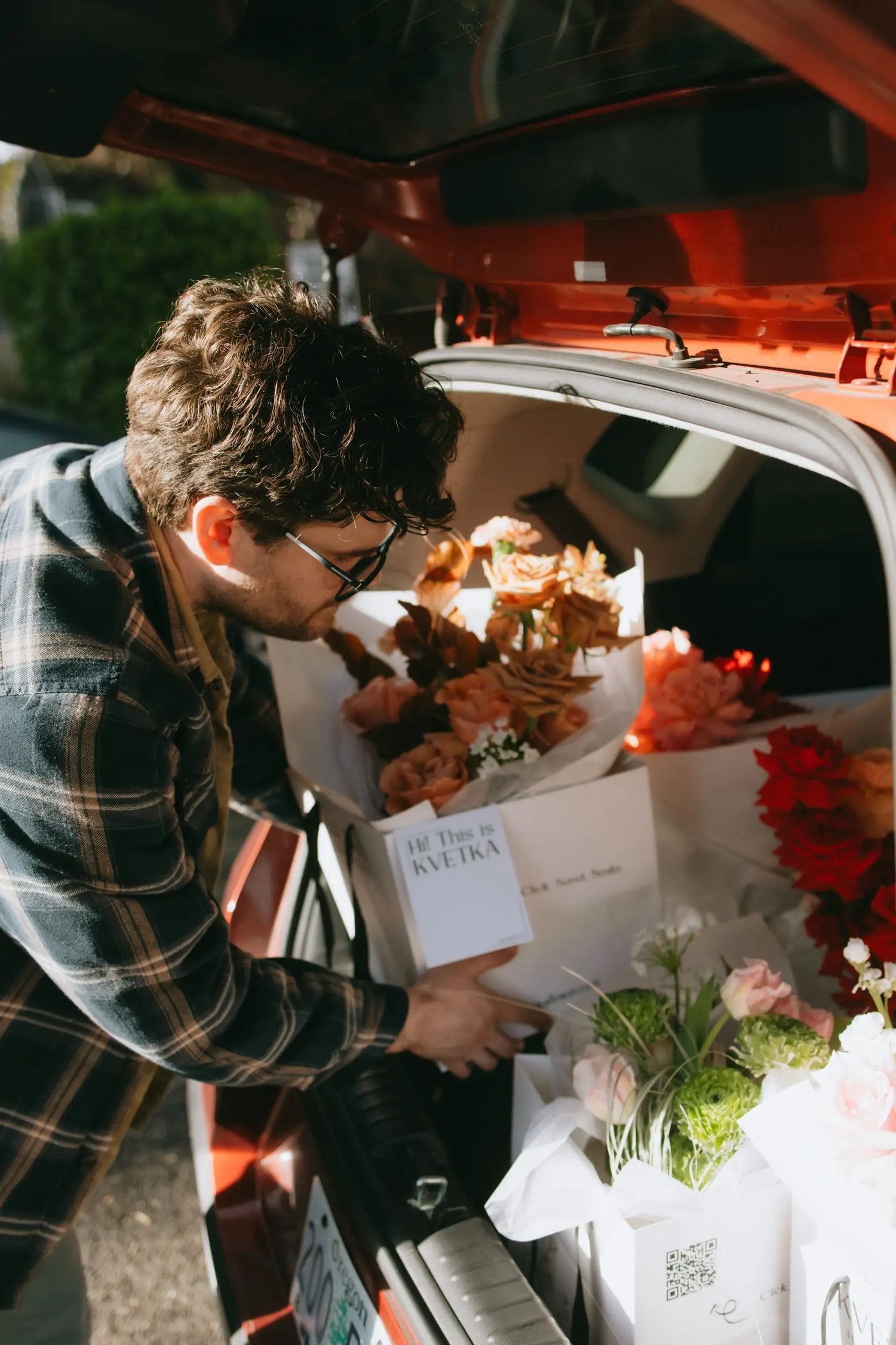 Kvetka Flower Portland florist loading Valentine's Day bouquets for same-day delivery - behind the scenes