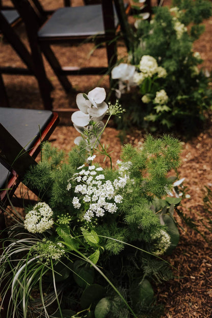 Close-up of aisle flowers with Queen Anne’s lace and eucalyptus at Camp Colton – by Kvetka Flower, Portland OR

