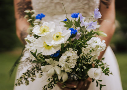Bridal bouquet with white poppies, blue cornflowers, and delicate greenery – by Kvetka Flower, Portland OR
