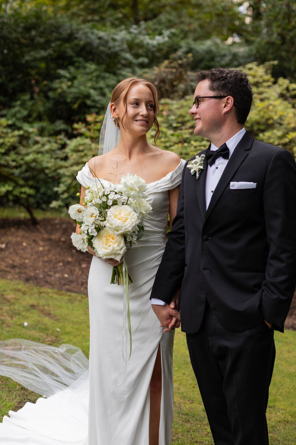 Bride and groom garden portrait with whimsical white Candlelight garden rose bridal bouquet by Kvetka Flower Portland