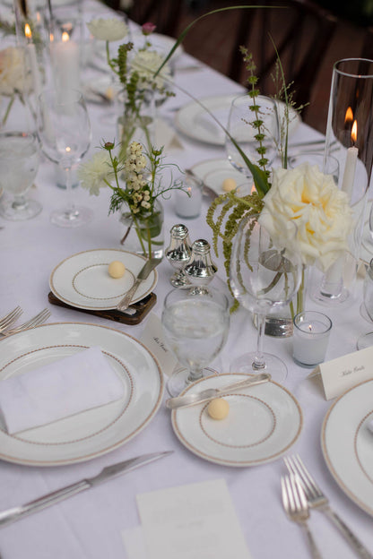 Elegant clear glass bud vase centerpiece detail with garden rose, white snowberry and trailing amaranthus by Kvetka Flower Portland