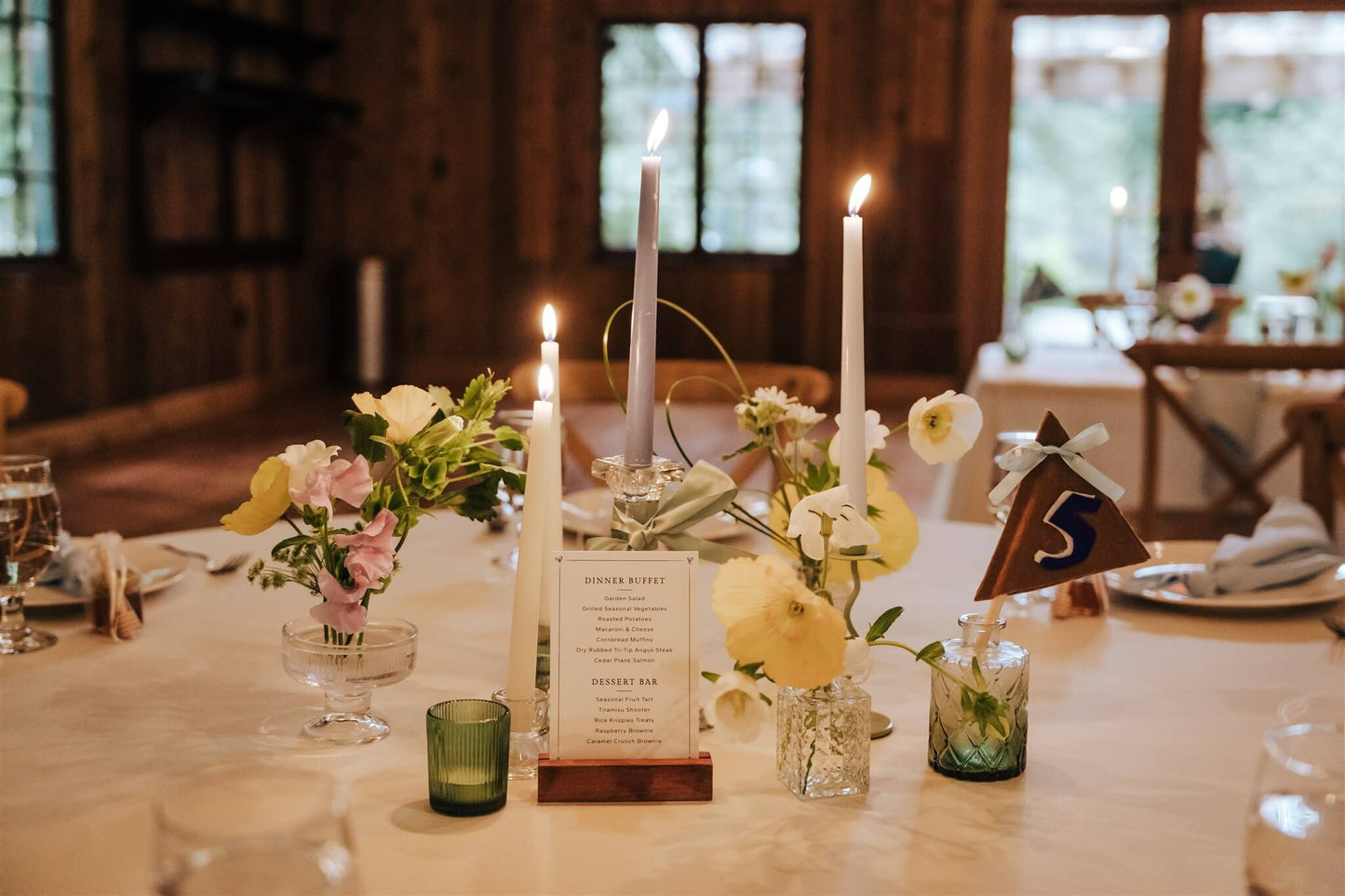 Reception table centerpiece with pastel flowers, taper candles and table number – by Kvetka Flower, Portland OR
