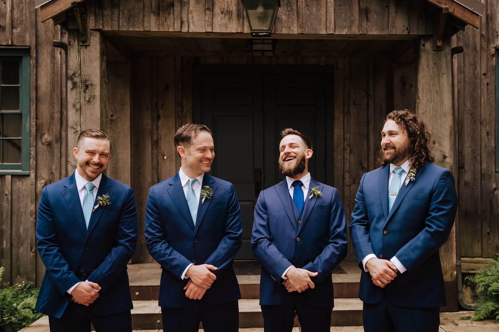 Groom and groomsmen in blue suits laughing before ceremony at Camp Colton – by Kvetka Flower, Portland OR
