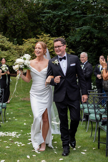 Bride and groom just married recessional with white garden rose bouquet and rose petals at The Town Club Portland by Kvetka Flower