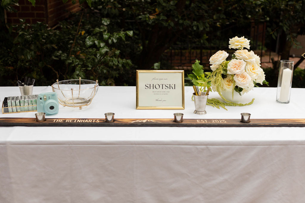 Wedding shotski guestbook table with white rose and trailing amaranthus arrangement by Portland florist Kvetka Flower