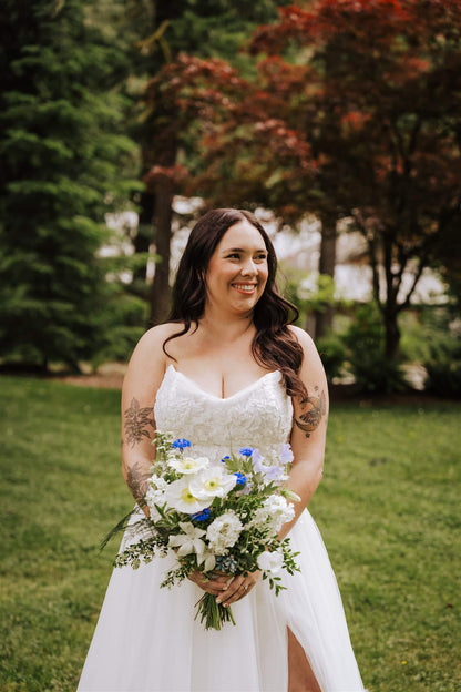 Full wedding party cheering outside rustic chapel at Camp Colton – by Kvetka Flower, Portland OR
