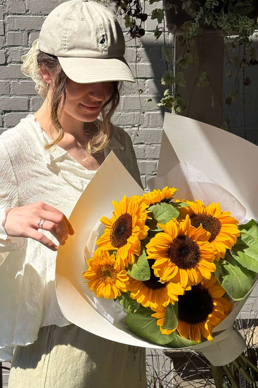Overhead shot of Sun Day bouquet featuring fresh local sunflowers, small size, Kvetka Flower Portland OR