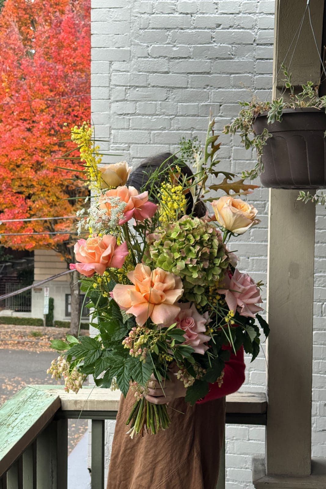 Pink Acacia rose bouquet with peach roses, green hydrangea, and yellow acacia seasonal variation by Kvetka Flower Portland